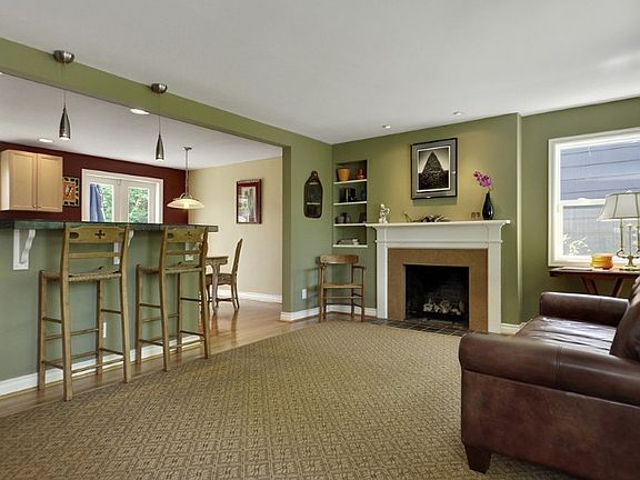 Open concept kitchen, living, dining rooms....perfect for entertaining! Oak hardwood floors, built-in shelves, and gas fireplace in living room.