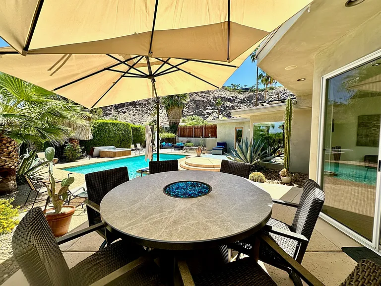 3 large umbrellas shade backyard