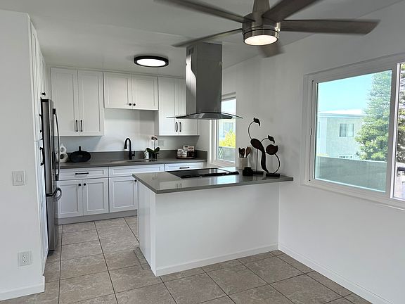 This newly renovated unit features beautiful flooring, natural lighting, spacious rooms, and ceiling fans throughout for your comfort.