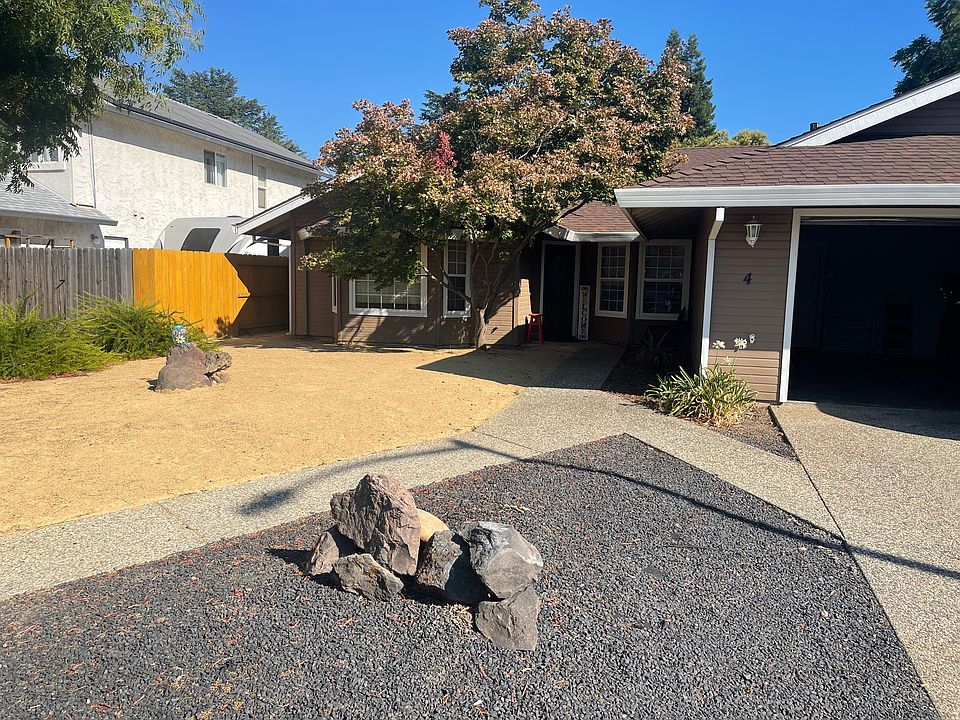 Front of house, crushed granite, low maintenance.