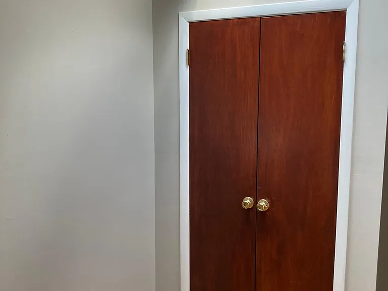 Smaller Bedroom Closet with Skylight