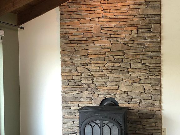 Stone and granite wood stove surround.