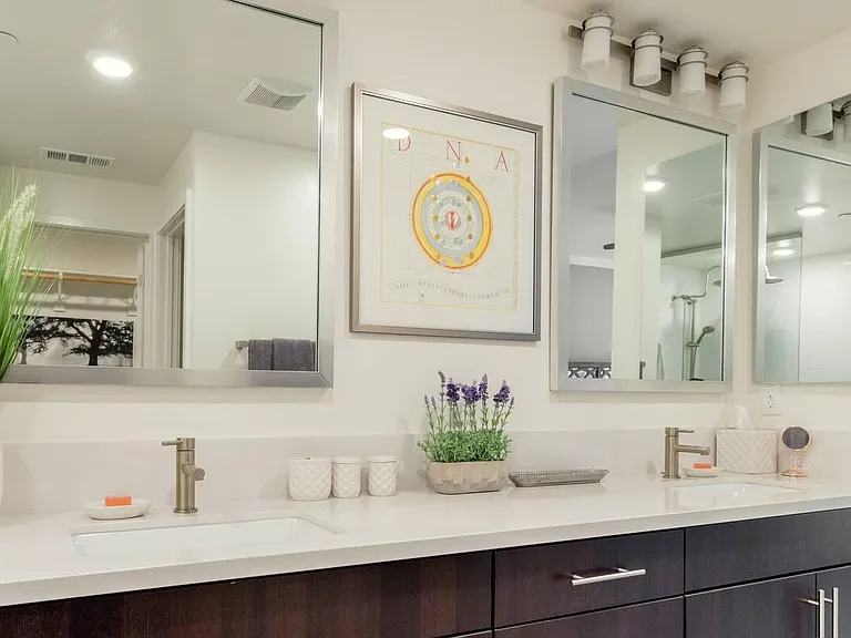 His and her sinks coupled with the natural stone countertops provide a lot of room for anyone seeking peace and tranquility.