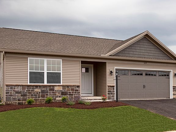 Exterior front view of the Elmcrest A ranch floorplan by S A Homes - single storyhome with vinyl sid