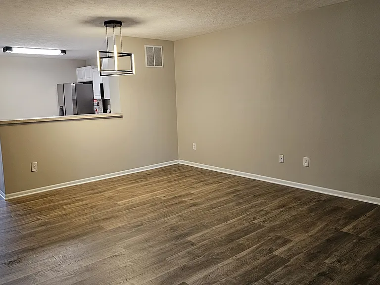 Spacious living room with wooden flooring