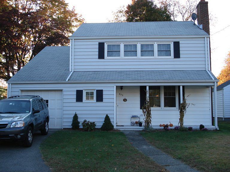 On a dead end.  Gray with black shutters.