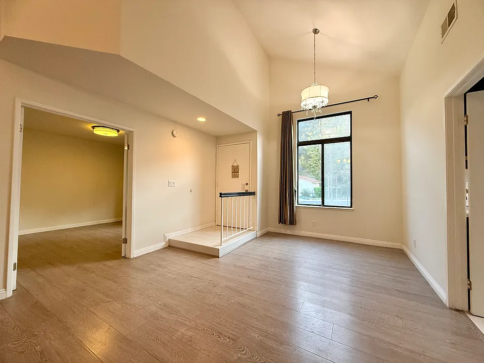 Open Floor Plan with High Ceilings, including Entrance, Dining Room and Bedroom One Downstairs