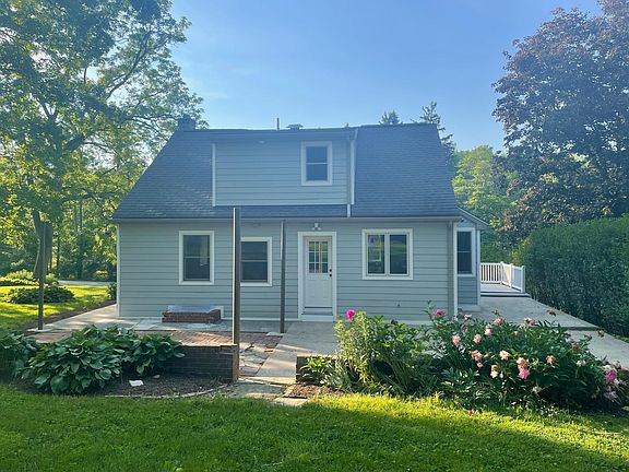 Back of house with large patio