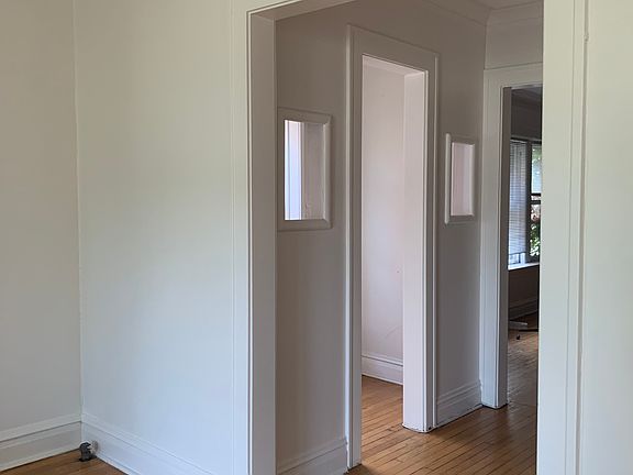 entryway between living room and dining room with storage/coat room (some people used it as a office)
