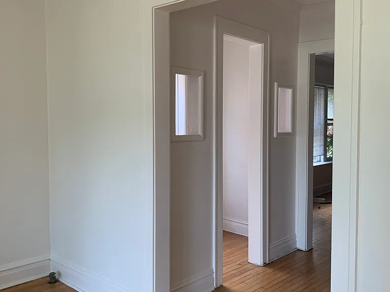 entryway between living room and dining room with storage/coat room (some people used it as a office)