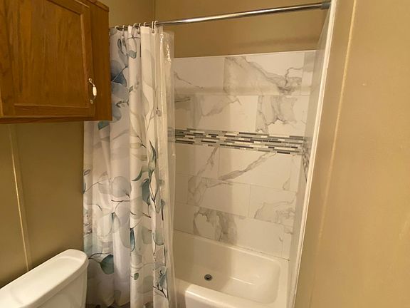 2nd bathroom with tiled shower.