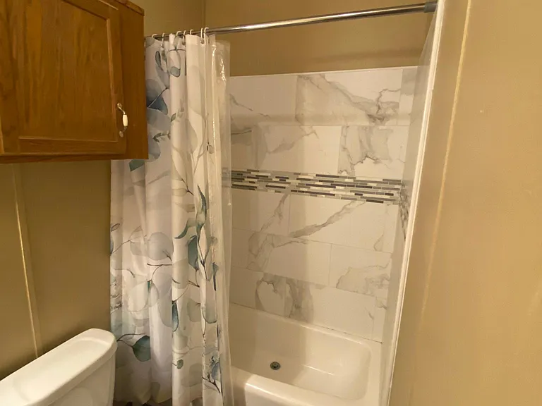 2nd bathroom with tiled shower.