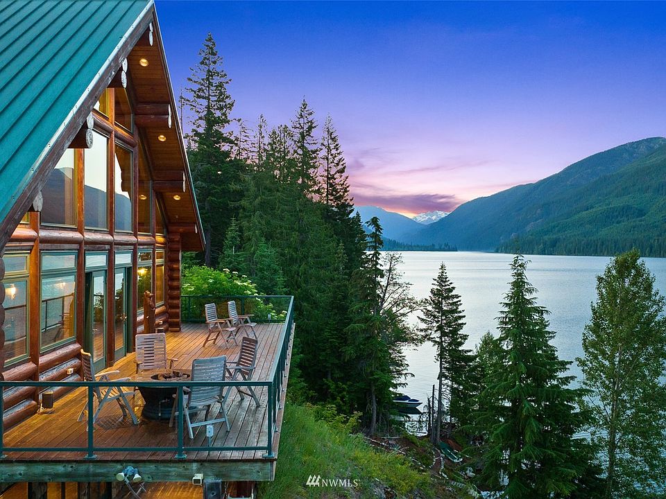 This home was featured in 2005 "Country's Best Vacation Log Homes" magazine. Some have stated that this is probably the nicest waterfront log cabin in the state. Sitting over 80 feet high above the lake lies your own oasis! This home and setting truly make this "a once in a lifetime opportunity" and are unreproducible.>