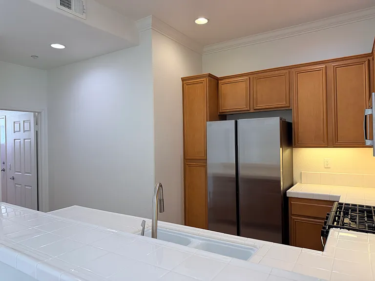 Kitchen left door leads to the laundry room