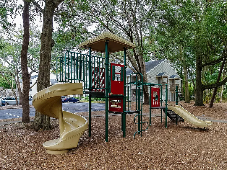 Enjoy family fun in this spacious playground nestled among verdant trees.