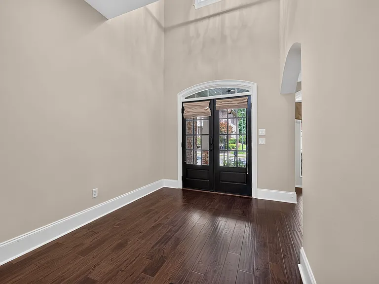 Bright and huge 2 story foyer with light from front doors and big window over front door