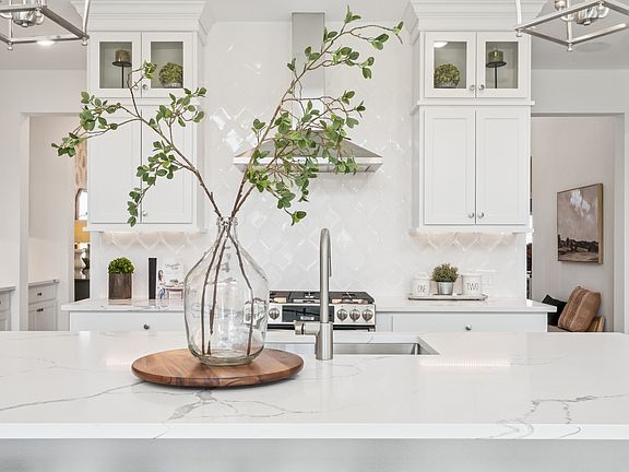 Kitchen with full-height tile backsplash