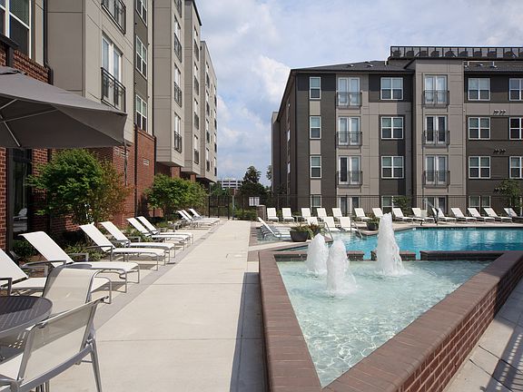 Two Resort-Style Swimming Pool with Expansive Tanning Areas and Sun Shelf