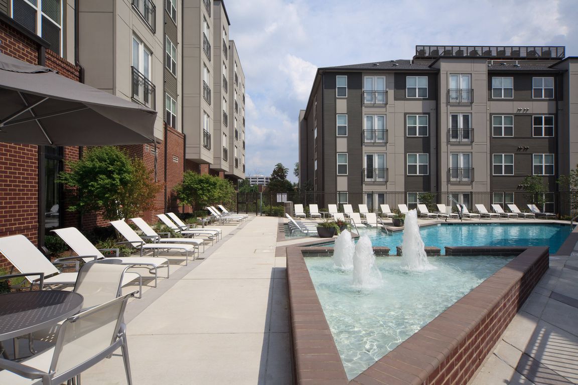 Two Resort-Style Swimming Pool with Expansive Tanning Areas and Sun Shelf