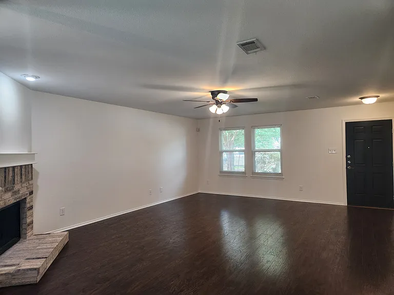 Living room has fireplace