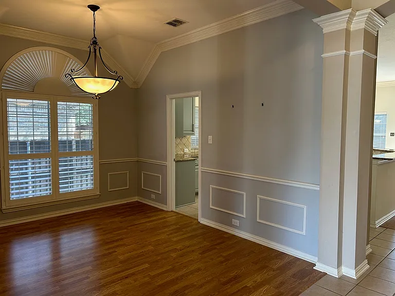 Formal dining room with crown molding, just off entry way.