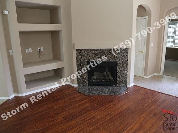 Living room features a switch start gas fireplace and an ent