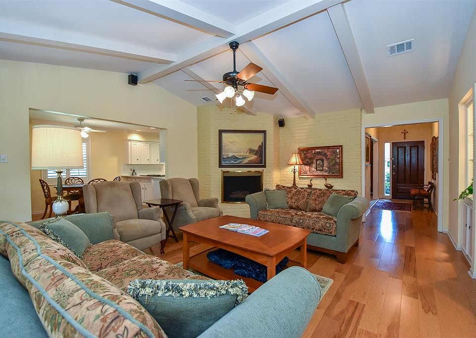 Gleaming wood floors welcome you into this spacious one story home featuring generous size rooms and many updates throughout.
