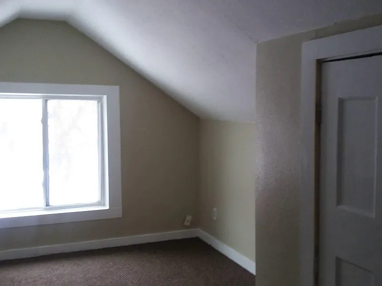 Loft Bedroom bathed in sunlight. This room fits a queen size bed comfortably