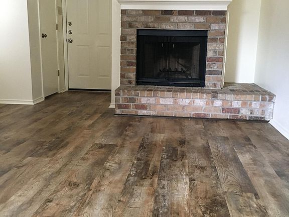 Good size Living Room with coat closet, fireplace and ceiling fan.