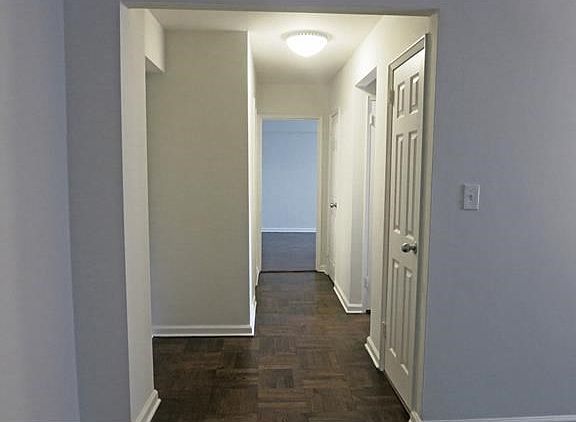 Stained and refinished hardwood floors and new base moldings.