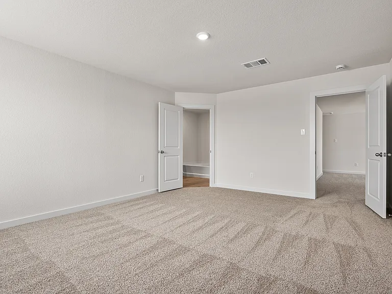 The master suite has a large bedroom, ensuite bathroom and walk-in closet.