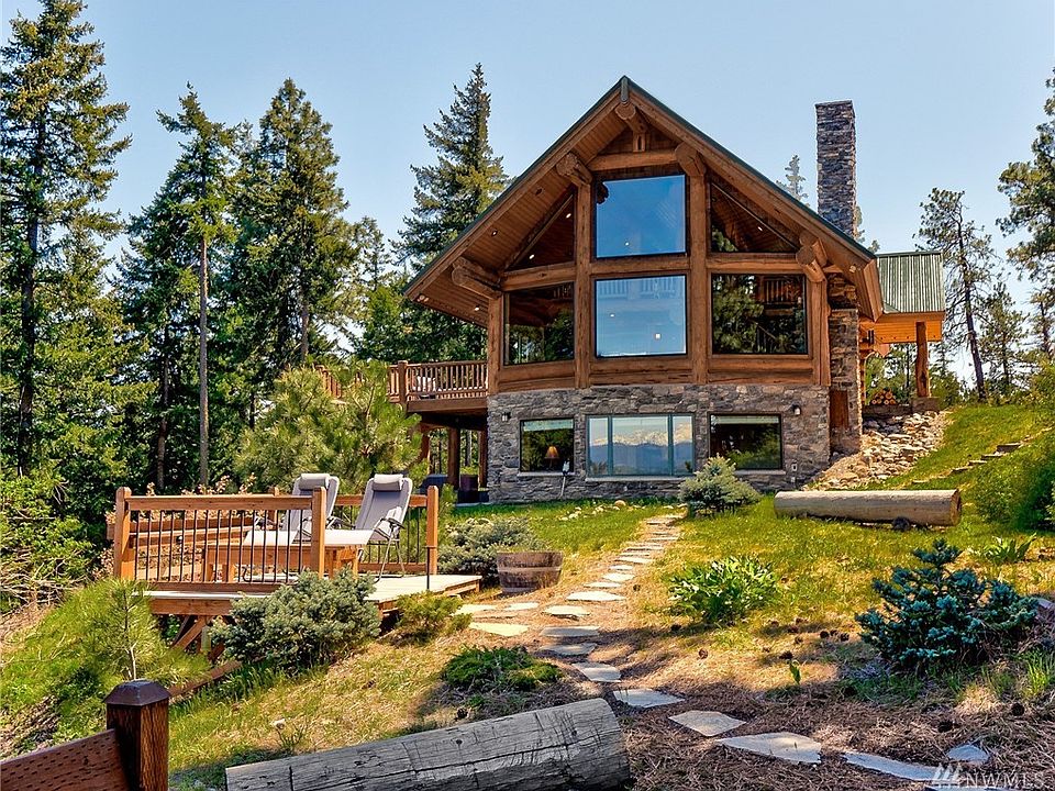 Spectacular, Panoramic, Impeccably kept, Log/Stone home with unobstructed views of the Stuart Mountain Range from every floor! 