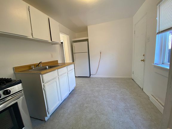 Kitchen with door to back patio.