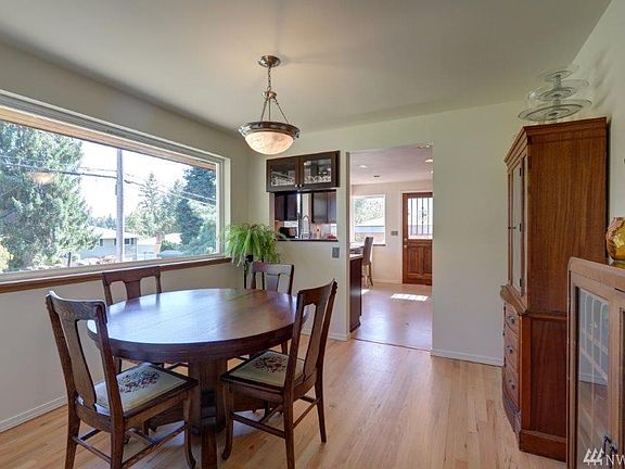 Formal dining room with huge picture window and hardwood floors