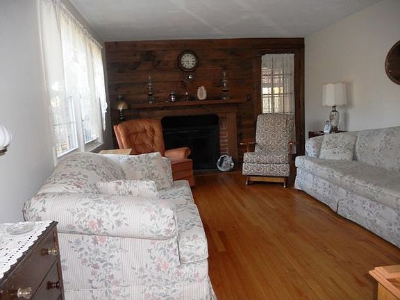 Fireplaced living room with hardwood floors