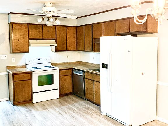 Kitchen with new refrigerator and dishwasher