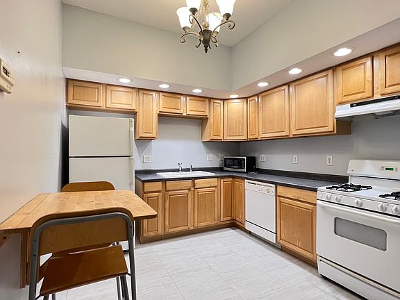 Kitchen with all major appliances and built-in
