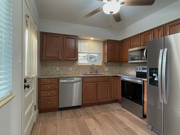 Dishwasher, electric range, microwave, refrigerator with water and ice dispenser.