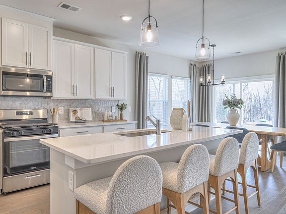 Prep dinner in the kitchen without missing the conversation in the dining area.