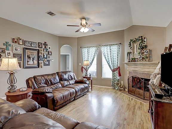 Family room features high ceilings, and there is a ton of natural light in this home.