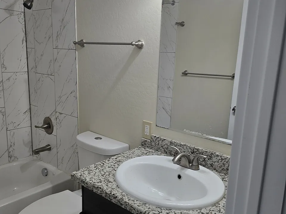 beautiful bathrooms include a tub and shower!