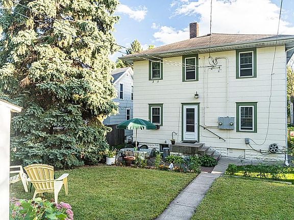 Back View and Entrance of Duplex. Backyard and Patio.