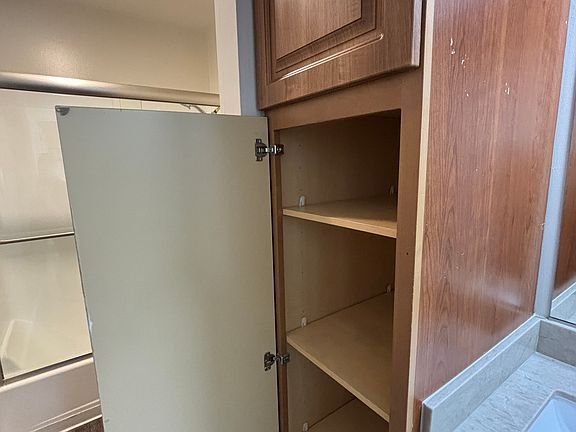 Bathroom has extra linen cabinets