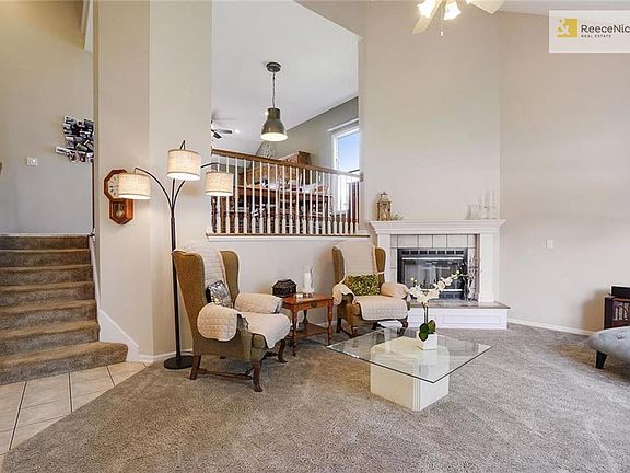 Impressive as soon as you open the door!  Vaulted ceiling, lots of light. Corner fireplace.