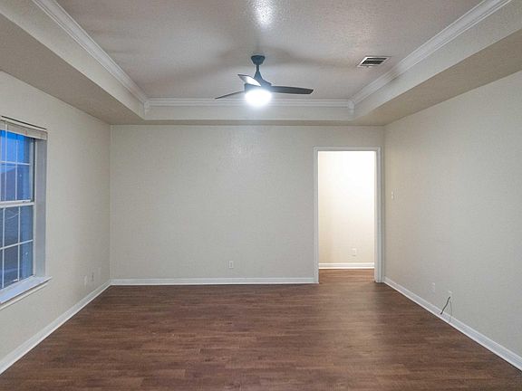 Good Sized Living Room, the ceilings are inset creating extra height, no more hitting your hands on the fan!