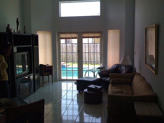 French doors from Family Rm invite you to pool area