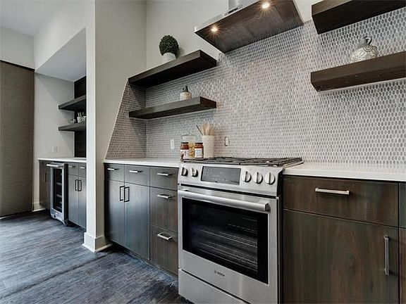 NEVER used and newly installed BOSCH gas range! Top of the line appliances...this condo is a higher quality than anything you will find!