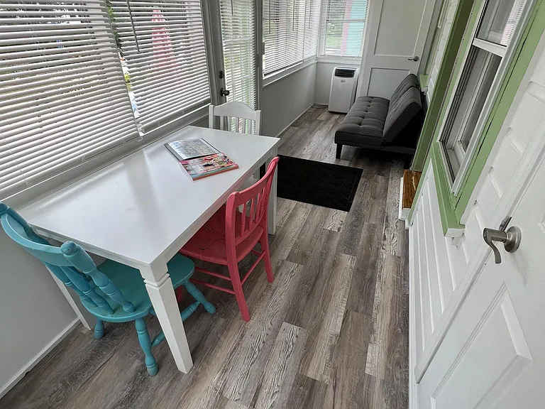 Enclosed, heated front porch with twin futon