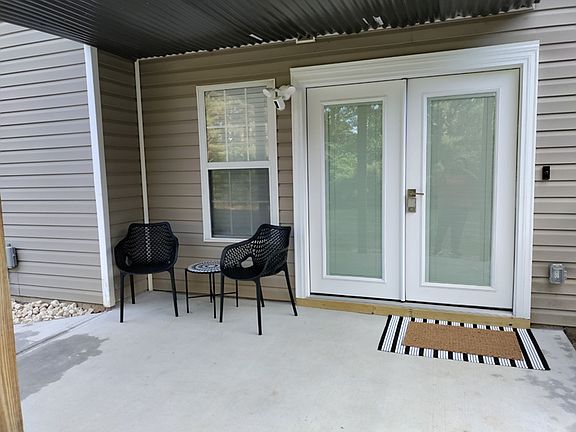 French Door entry with patio seating.