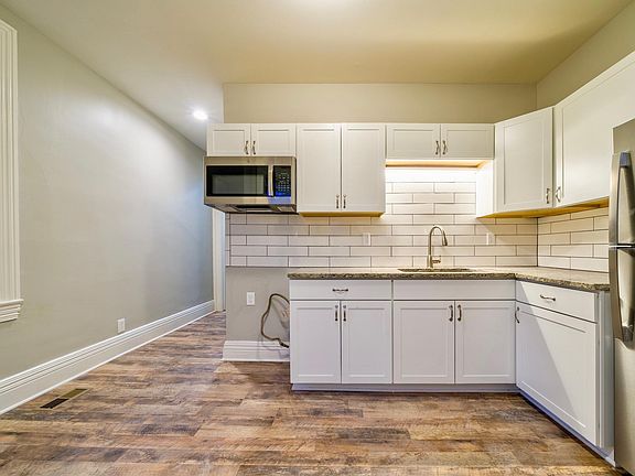 Brand New Kitchen with Granite Counters and custom back splash